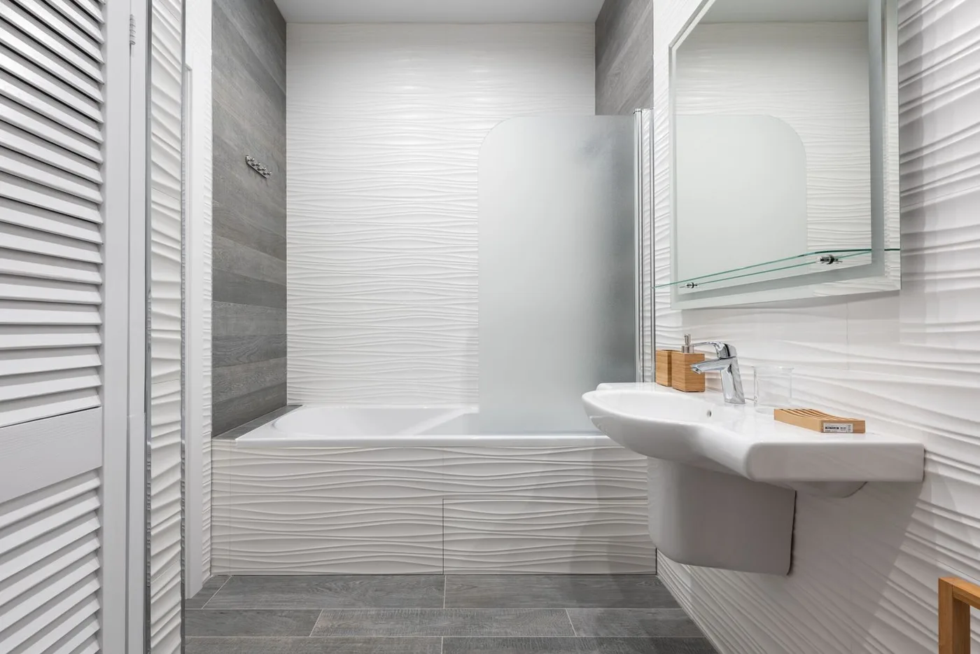 A bathroom with a wall mirror and washstand