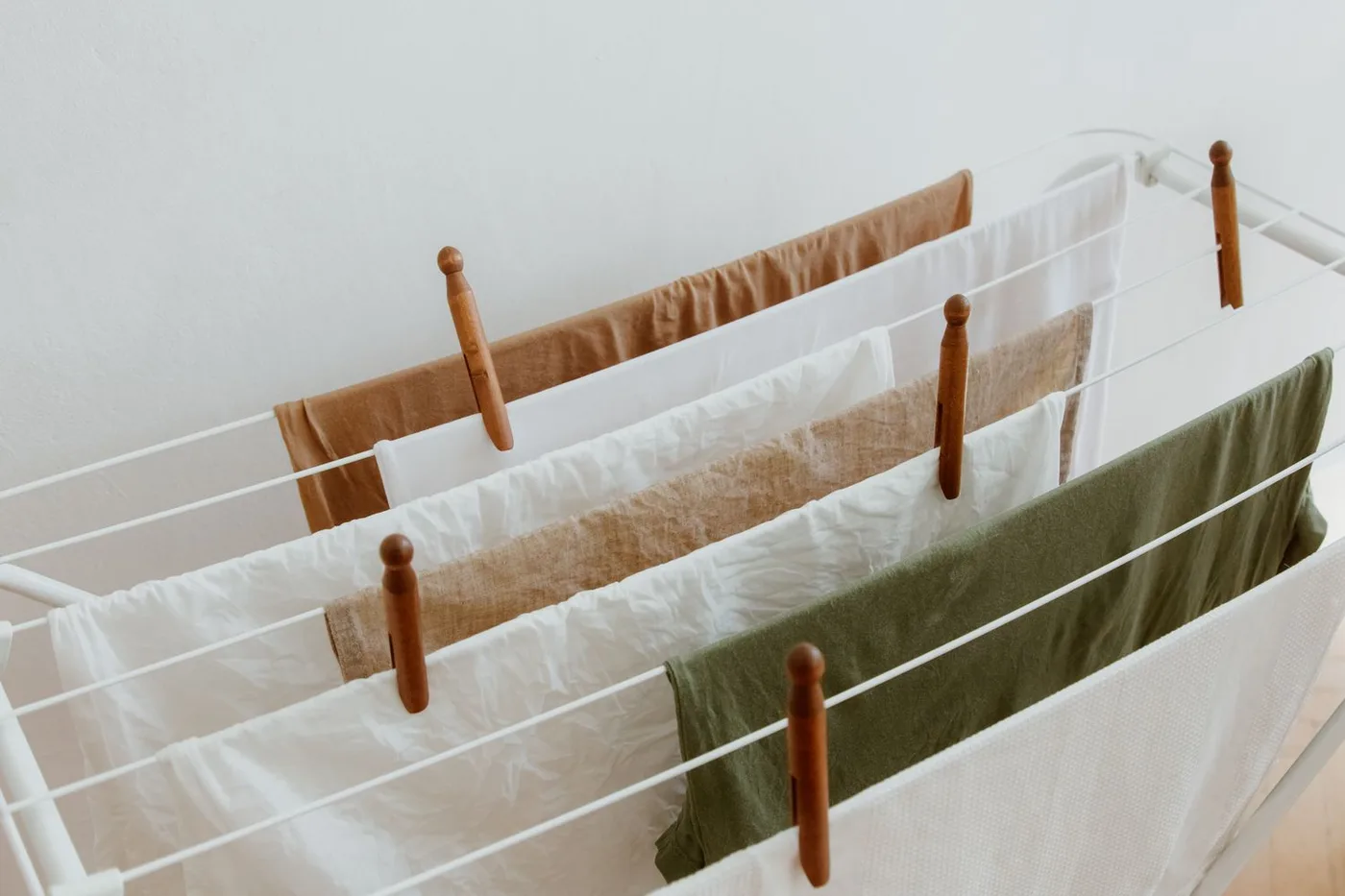 Clean laundry drying on a household folding rack