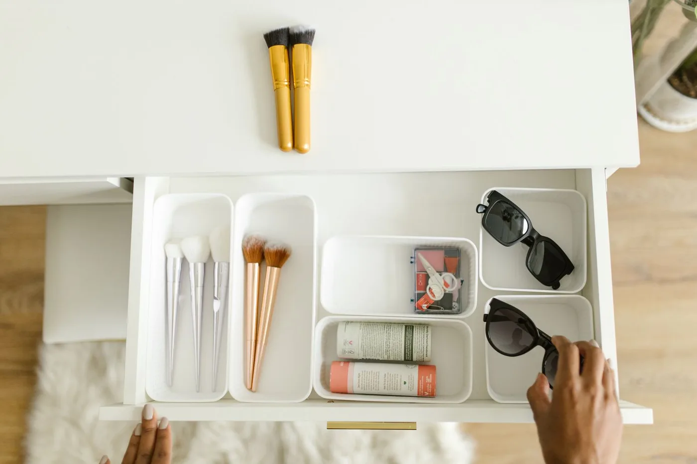 Personal care items being organized in a drawer